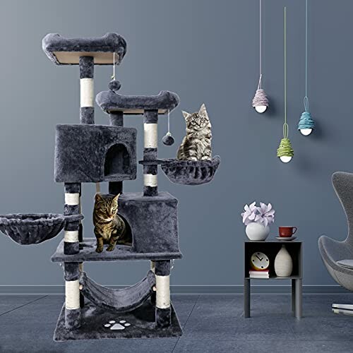 Two cats on a multi-level gray cat tree in a modern room.