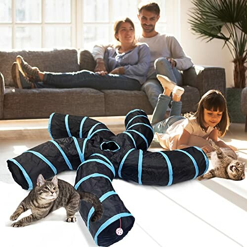 Family relaxing in living room with cats playing in tunnel toy.