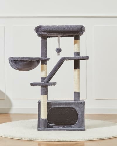 Gray cat tree tower with multiple levels and a hanging toy.
